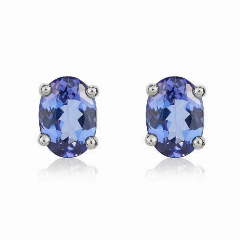 9ct White Gold Tanzanite 7x5mm Oval Claw Set Stud Earrings