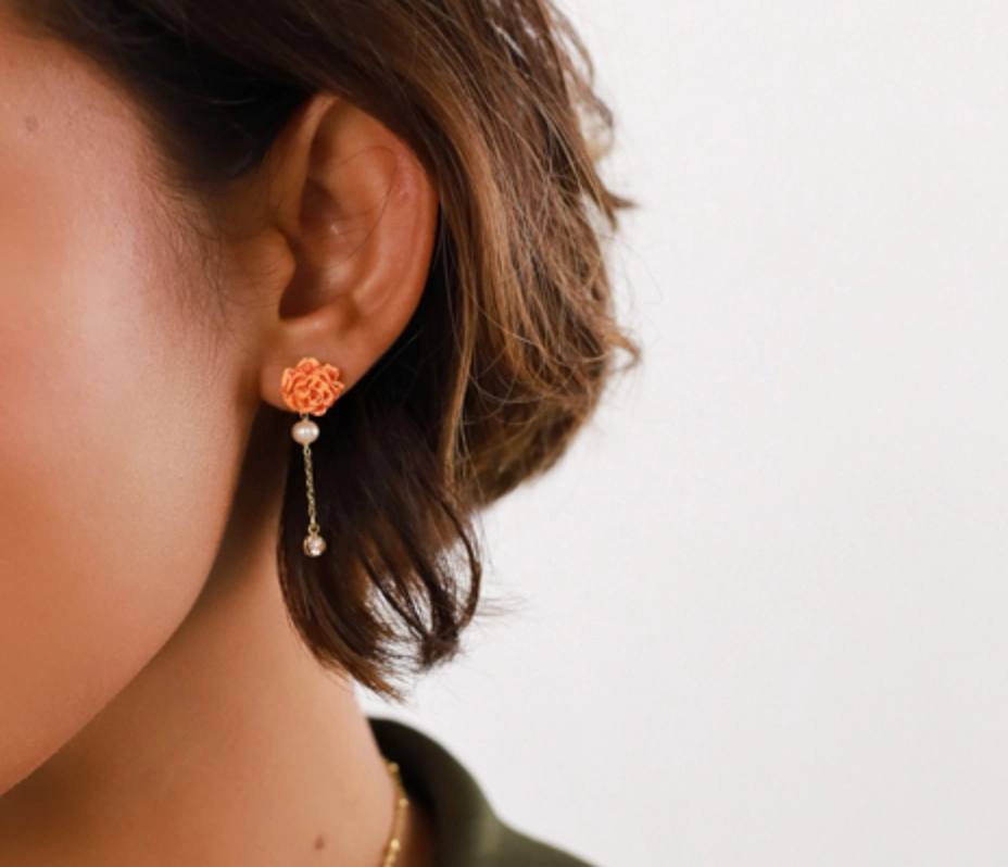 CLEA orange carnation flower post earrings